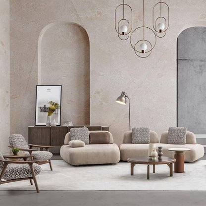 Modern living room with beige sofas, armchairs, and a coffee table in a stylish interior.