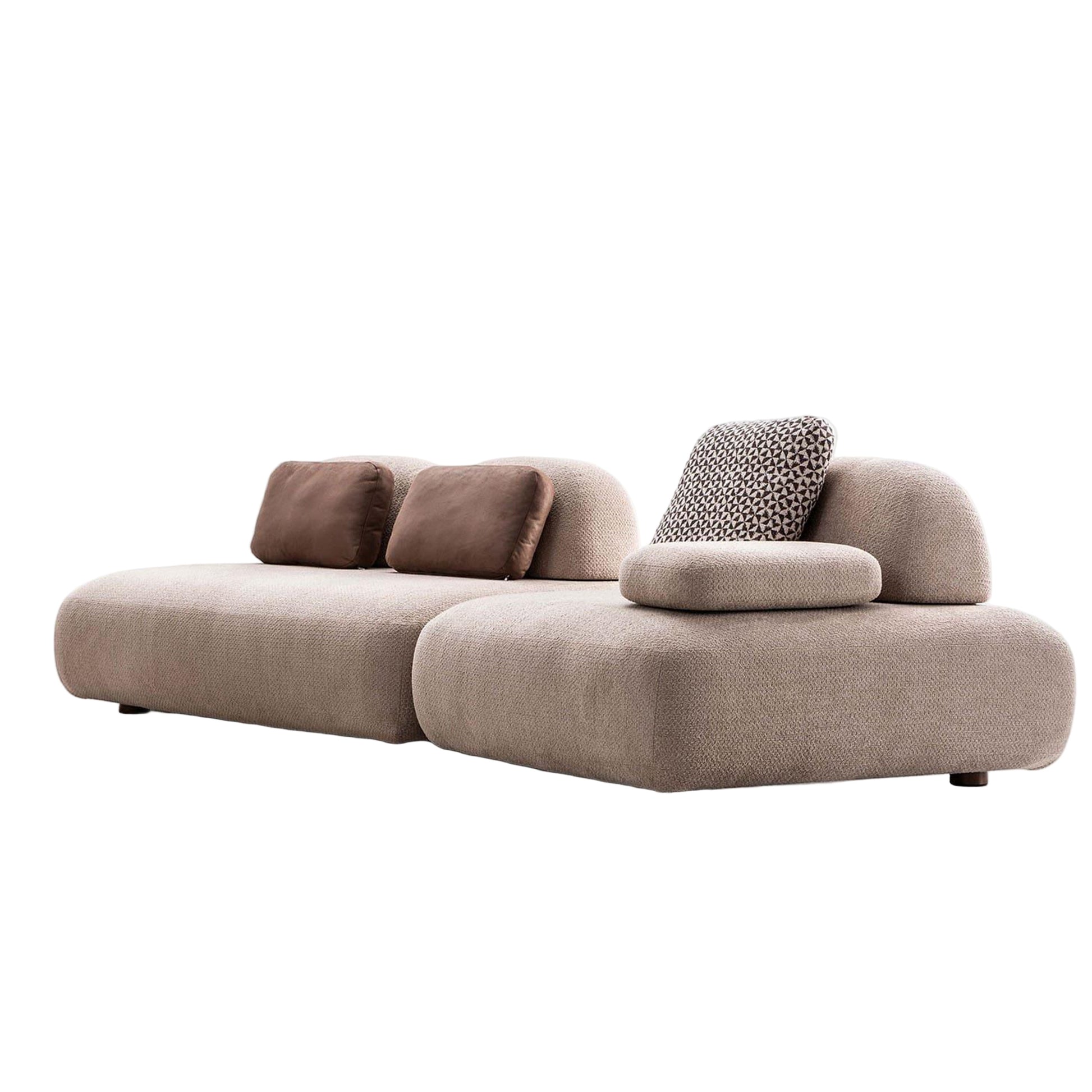 Beige sofa with brown and patterned cushions on a white background